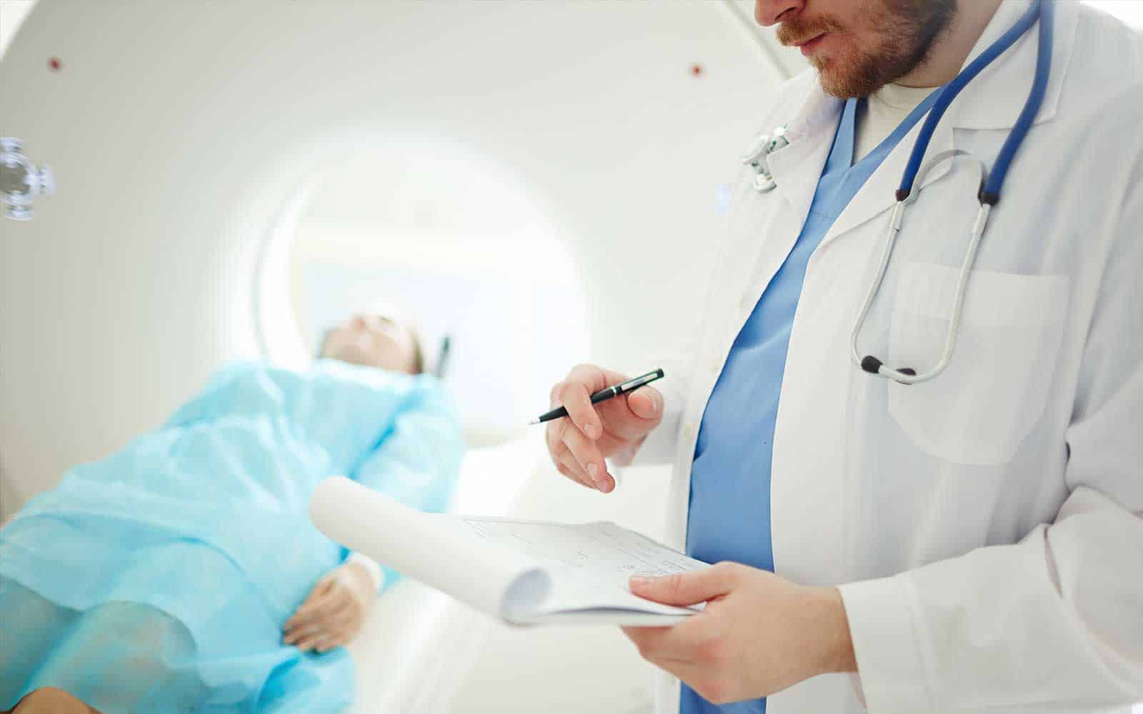 Doctor with CT scan patient